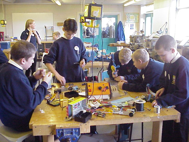 class at work on their robots